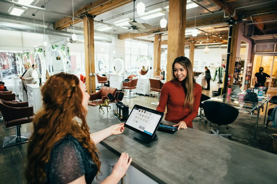 Two women in a hair salon.
